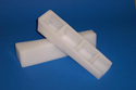 "Material Wedge" (used to wedge "Material" in packaging to prevent movement) - custom molded polyethylene part